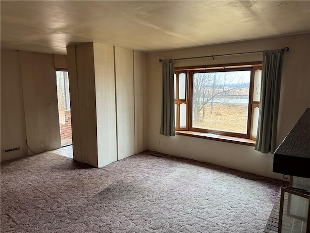 W5588 US Highway 8, Tony, WI 54563 - empty room featuring visible vents and carpet floors