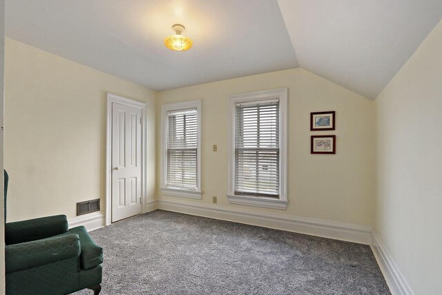 8207 12th St, Kenosha, WI 53144 - sitting room featuring carpet flooring, baseboards, vaulted ceiling, and visible vents