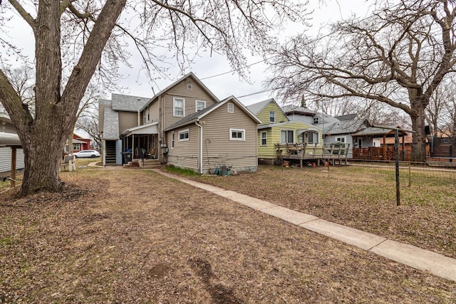 exterior space with a residential view and fence