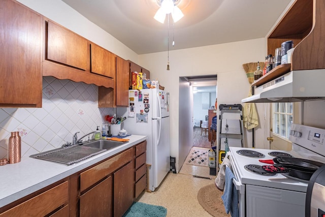 kitchen with white appliances, light countertops, open shelves, under cabinet range hood, and decorative backsplash