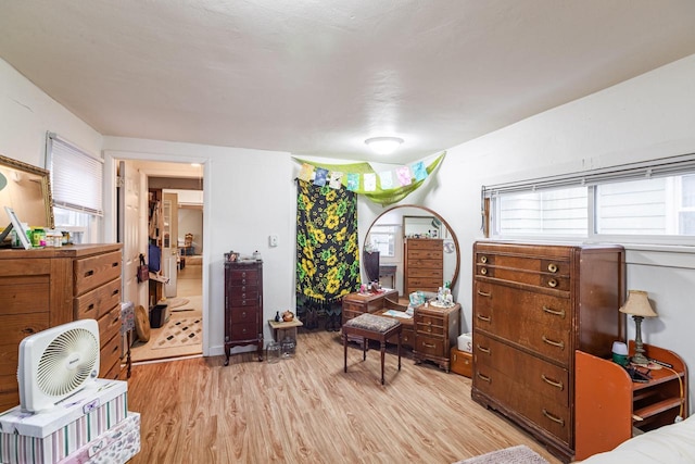 bedroom featuring light wood-style flooring