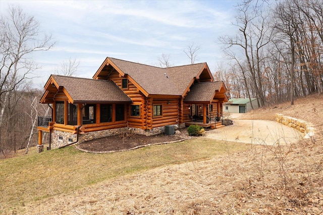 N8070 Wanlass Rd, Mindoro, WI 54644 - back of property featuring roof with shingles, a yard, and log exterior