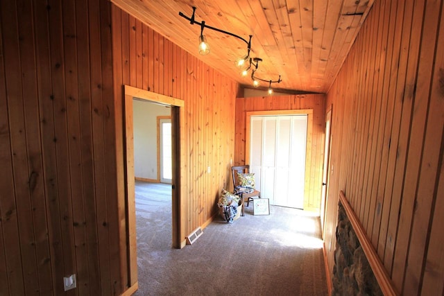 W7675 Moonshine Hill Rd, Wausaukee, WI 54177 - corridor with visible vents, wooden ceiling, carpet, wooden walls, and vaulted ceiling