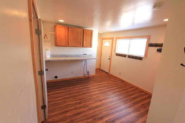 W7675 Moonshine Hill Rd, Wausaukee, WI 54177 - laundry area with recessed lighting, dark wood-style flooring, and baseboards