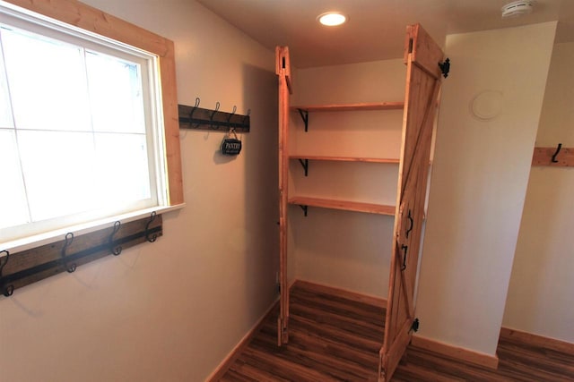 W7675 Moonshine Hill Rd, Wausaukee, WI 54177 - interior space with recessed lighting, a barn door, baseboards, and wood finished floors