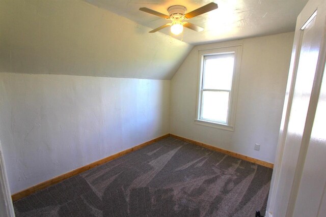 W7675 Moonshine Hill Rd, Wausaukee, WI 54177 - additional living space with baseboards, dark colored carpet, a ceiling fan, and lofted ceiling