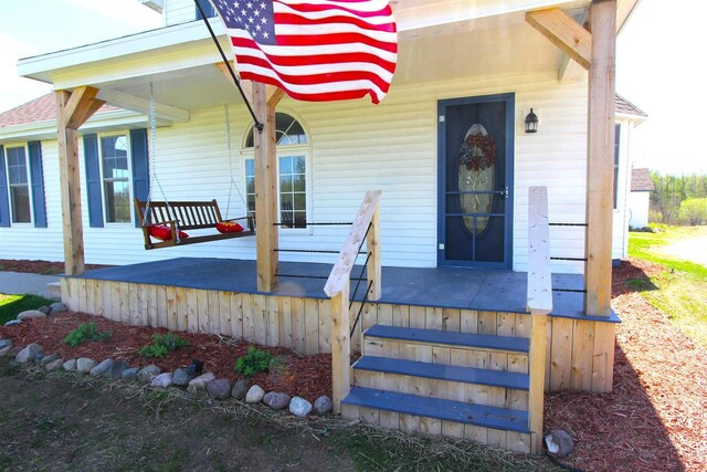W7675 Moonshine Hill Rd, Wausaukee, WI 54177 - view of exterior entry featuring covered porch