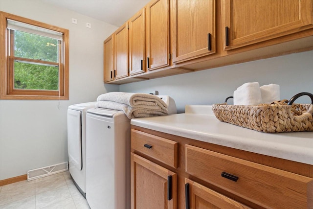 178 Weybridge Dr, Sun Prairie, WI 53590 - laundry room with cabinet space, baseboards, washing machine and dryer, and light tile patterned flooring