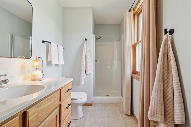 178 Weybridge Dr, Sun Prairie, WI 53590 - bathroom with a stall shower, toilet, vanity, baseboards, and tile patterned floors