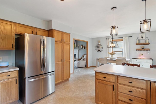 178 Weybridge Dr, Sun Prairie, WI 53590 - kitchen with freestanding refrigerator, light countertops, pendant lighting, and light flooring