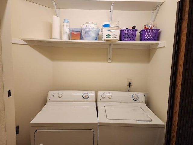 washroom with washing machine and dryer