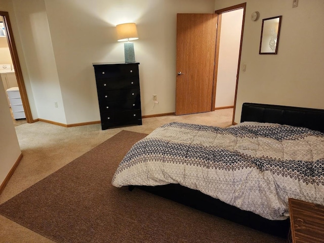 bedroom featuring carpet and baseboards