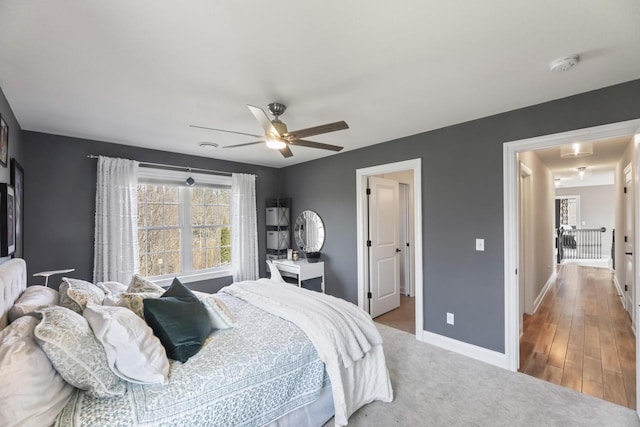 W246N1979 Still River Dr, Pewaukee, WI 53072 - bedroom with light colored carpet, baseboards, and a ceiling fan