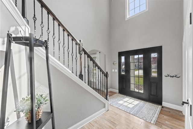 W246N1979 Still River Dr, Pewaukee, WI 53072 - foyer entrance with wood finished floors, a towering ceiling, baseboards, and stairway