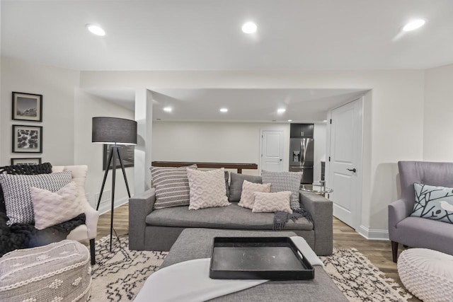 W246N1979 Still River Dr, Pewaukee, WI 53072 - living room with recessed lighting, light wood-style floors, and baseboards