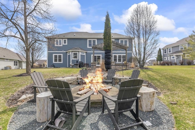 W246N1979 Still River Dr, Pewaukee, WI 53072 - back of house with a yard, central AC unit, a fire pit, and a pergola