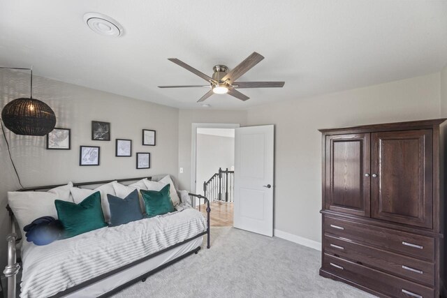 W246N1979 Still River Dr, Pewaukee, WI 53072 - bedroom with baseboards, a ceiling fan, and light colored carpet