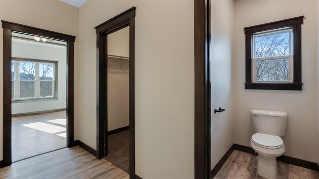 LOT3 510th Ave, Menomonie, WI 54751 - bathroom featuring baseboards, toilet, and wood finished floors
