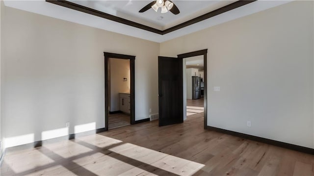 LOT3 510th Ave, Menomonie, WI 54751 - empty room featuring wood finished floors, baseboards, a ceiling fan, and visible vents