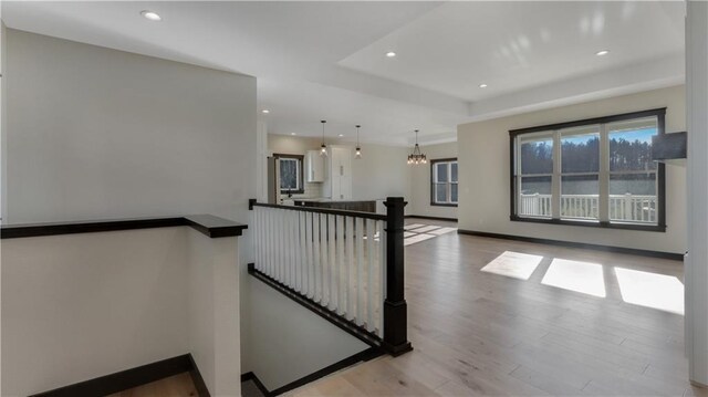 LOT3 510th Ave, Menomonie, WI 54751 - stairway featuring a wealth of natural light, recessed lighting, an inviting chandelier, and wood finished floors