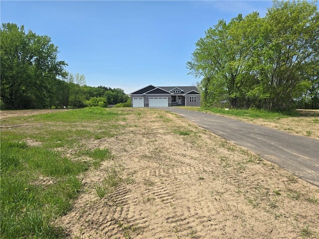 LOT3 510th Ave, Menomonie, WI 54751 - single story home with a garage and aphalt driveway