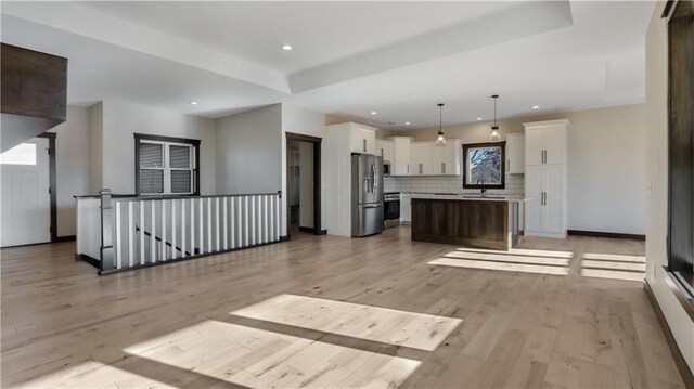 LOT3 510th Ave, Menomonie, WI 54751 - unfurnished living room with light wood-style flooring, a sink, and recessed lighting