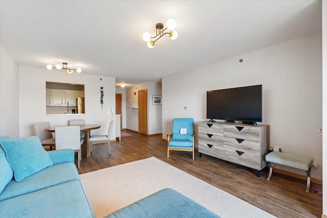 living room featuring baseboards and wood finished floors