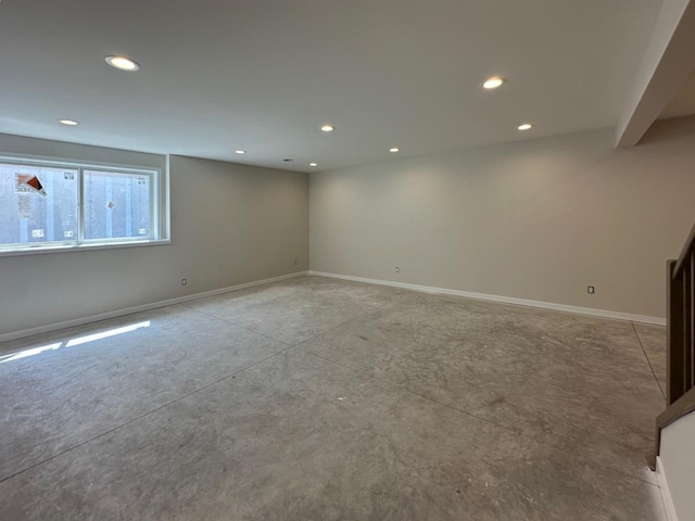 1310 Spahn Dr, Waunakee, WI 53597 - empty room featuring finished concrete floors, recessed lighting, and baseboards