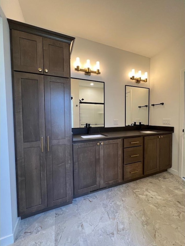 1310 Spahn Dr, Waunakee, WI 53597 - full bathroom with double vanity and baseboards