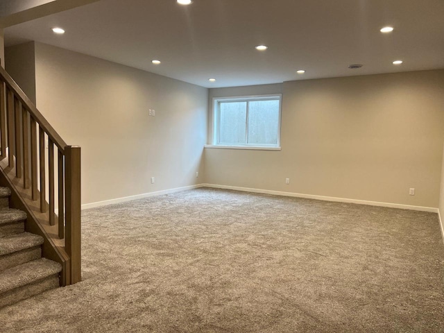 1310 Spahn Dr, Waunakee, WI 53597 - basement featuring carpet flooring, recessed lighting, baseboards, and stairway