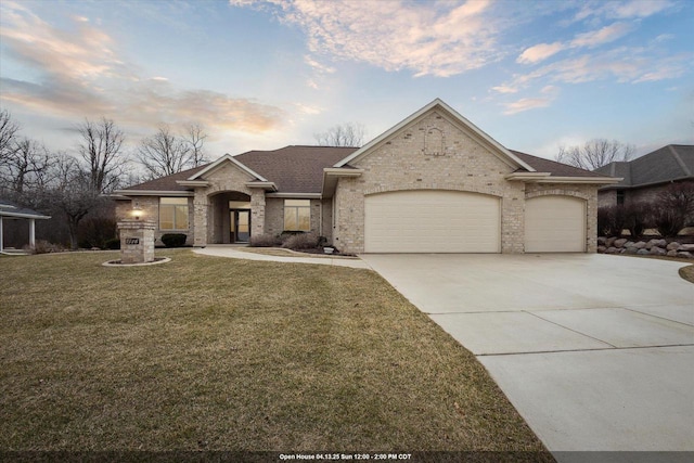 1716 Symphony Hts, Green Bay, WI 54311 - view of front of house with concrete driveway, a front lawn, brick siding, a garage, and a shingled roof