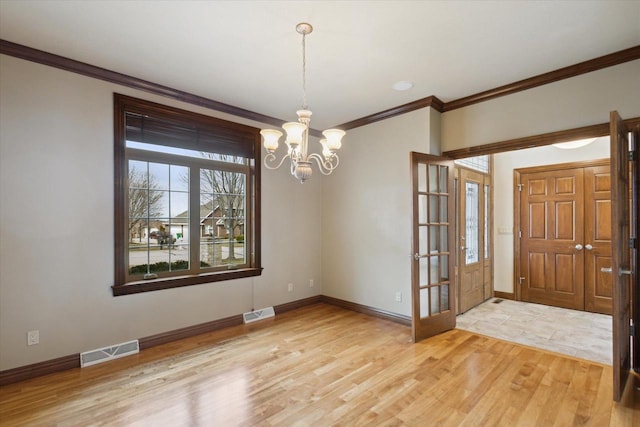 1716 Symphony Hts, Green Bay, WI 54311 - interior space with a chandelier, light wood-style floors, ornamental molding, and visible vents