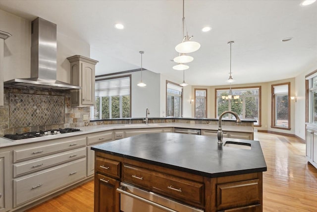 1716 Symphony Hts, Green Bay, WI 54311 - kitchen with wall chimney exhaust hood, gas cooktop, a warming drawer, a sink, and decorative backsplash