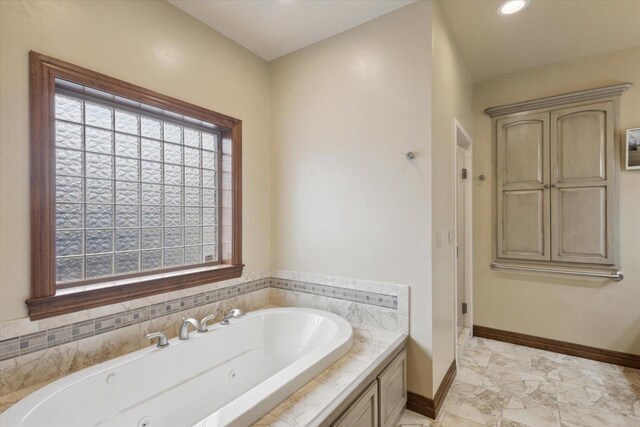 1716 Symphony Hts, Green Bay, WI 54311 - full bathroom featuring a whirlpool tub, marble finish floor, and baseboards