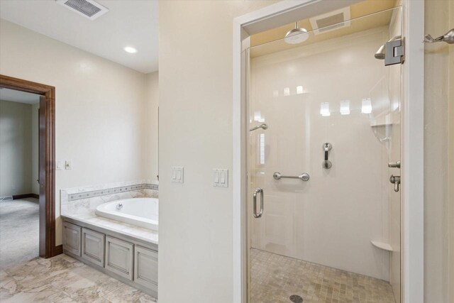 1716 Symphony Hts, Green Bay, WI 54311 - full bathroom featuring a shower stall, a bath, and visible vents