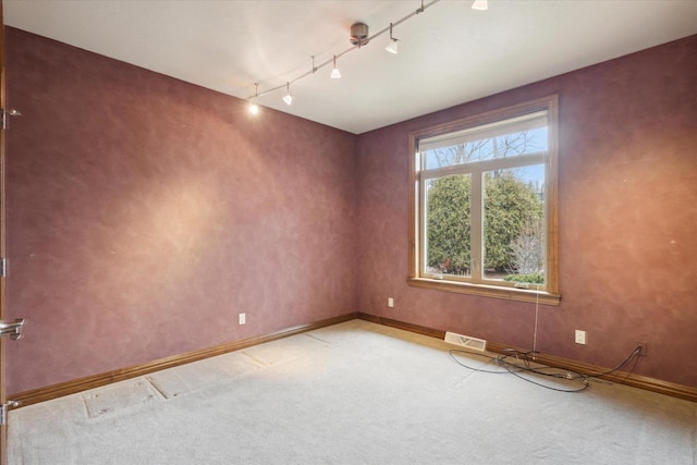 1716 Symphony Hts, Green Bay, WI 54311 - spare room with light carpet, visible vents, baseboards, and track lighting