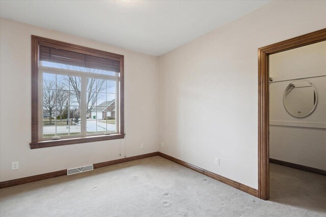 1716 Symphony Hts, Green Bay, WI 54311 - unfurnished bedroom featuring carpet flooring, baseboards, and visible vents