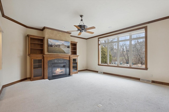 1716 Symphony Hts, Green Bay, WI 54311 - unfurnished living room featuring baseboards, a ceiling fan, visible vents, and carpet floors
