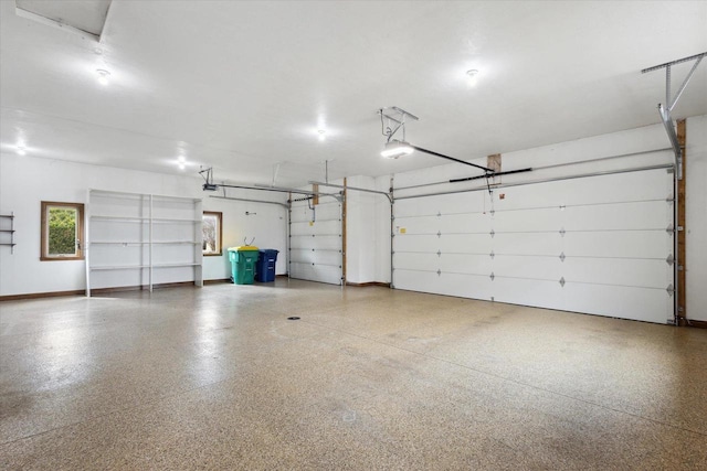 1716 Symphony Hts, Green Bay, WI 54311 - garage with baseboards and a garage door opener
