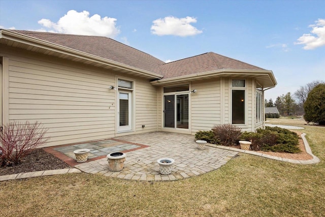 1716 Symphony Hts, Green Bay, WI 54311 - rear view of property featuring a patio, a yard, and roof with shingles