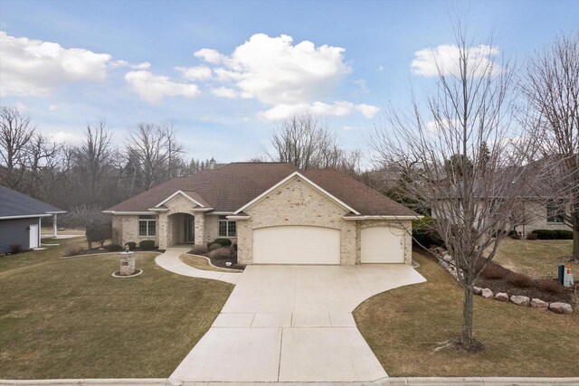 1716 Symphony Hts, Green Bay, WI 54311 - single story home featuring brick siding, driveway, an attached garage, and a front lawn