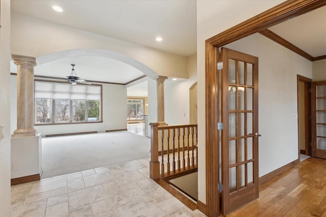 1716 Symphony Hts, Green Bay, WI 54311 - hallway featuring decorative columns, arched walkways, carpet flooring, and baseboards