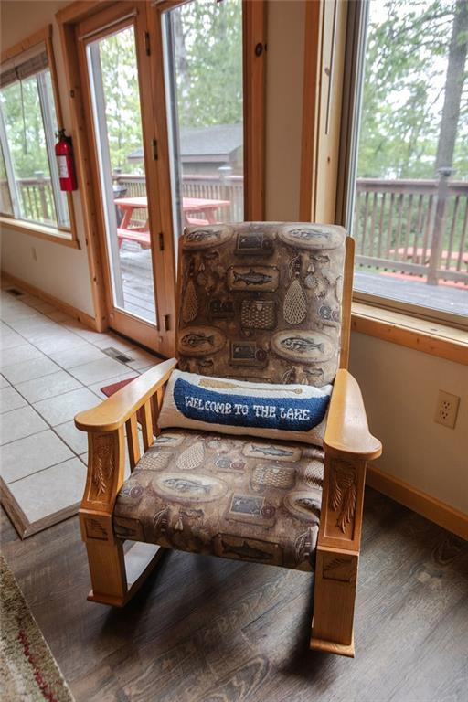6009 W Dobbert Rd, Winter, WI 54896 - living area featuring light wood-type flooring, baseboards, and visible vents