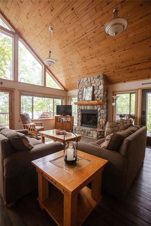 6009 W Dobbert Rd, Winter, WI 54896 - living room with a stone fireplace, high vaulted ceiling, wooden ceiling, and plenty of natural light