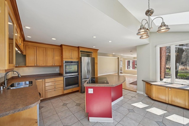 149 Oakwood Ave, Edgerton, WI 53534 - kitchen featuring a kitchen island, light tile patterned floors, a sink, and appliances with stainless steel finishes