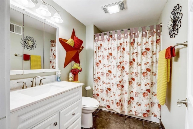 149 Oakwood Ave, Edgerton, WI 53534 - bathroom featuring tile patterned floors, vanity, visible vents, and toilet