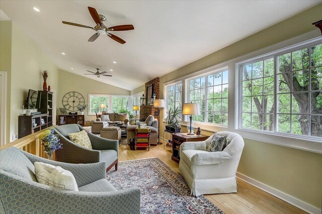 149 Oakwood Ave, Edgerton, WI 53534 - living area featuring lofted ceiling, ceiling fan, and a healthy amount of sunlight