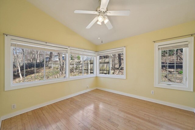 149 Oakwood Ave, Edgerton, WI 53534 - unfurnished room featuring plenty of natural light, wood-type flooring, and baseboards