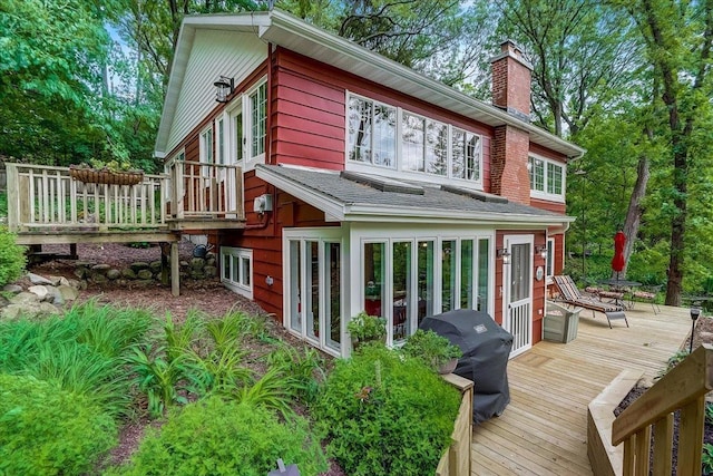 149 Oakwood Ave, Edgerton, WI 53534 - rear view of property featuring a wooden deck and a chimney