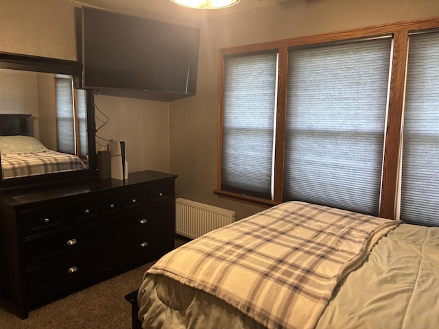bedroom with carpet and radiator
